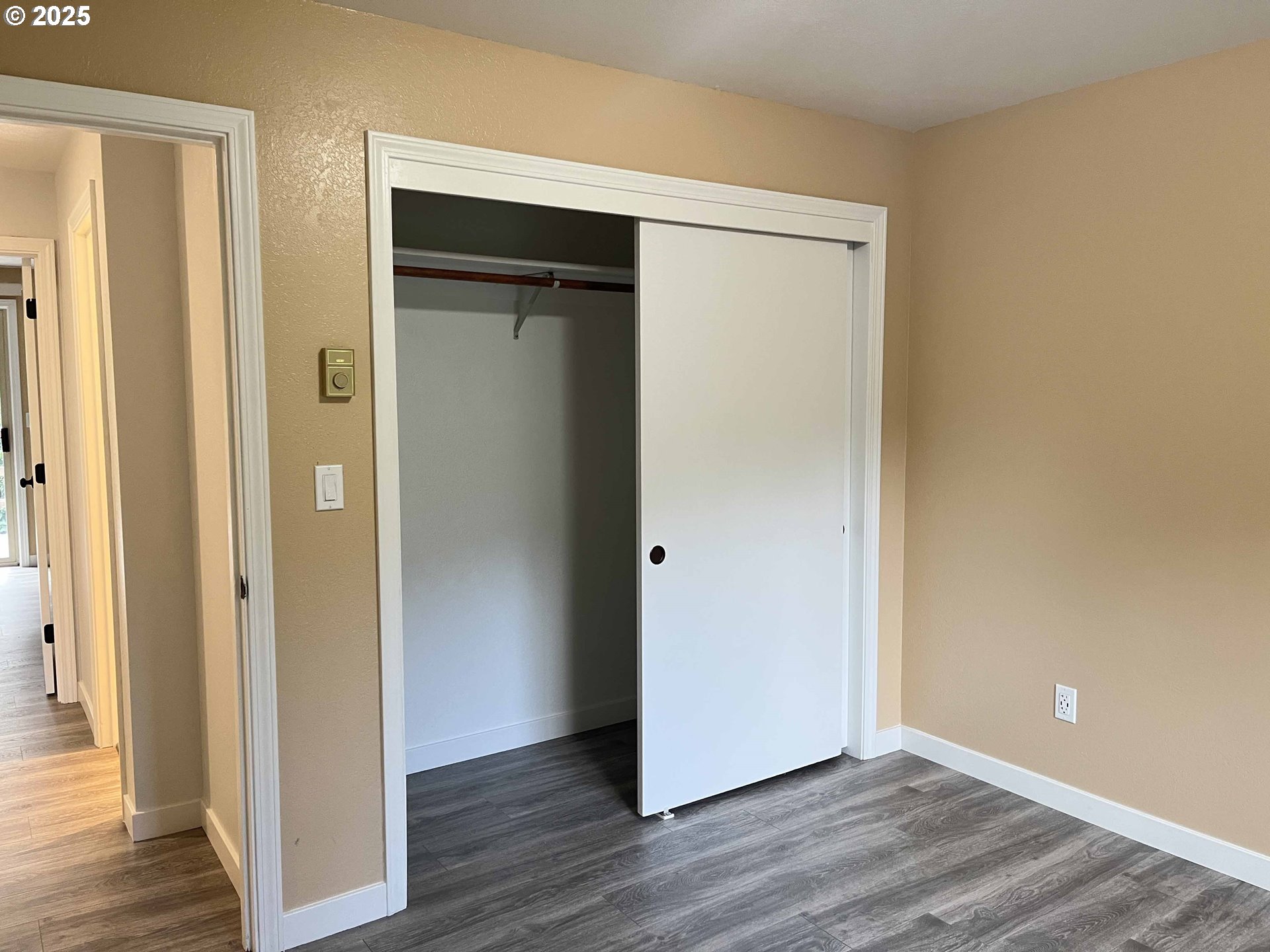2040 11th Street Florence, OR 97439 - Photo 26 of 43 a view of an empty room with wooden floor