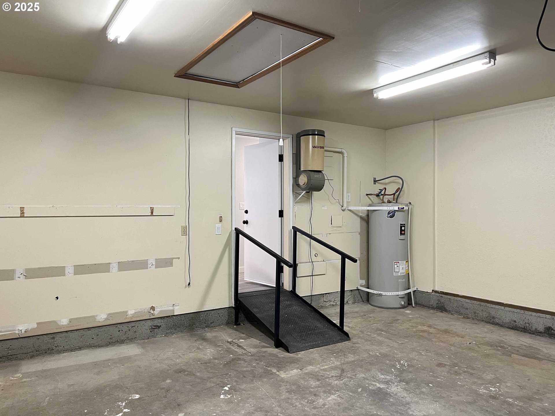 2040 11th Street Florence, OR 97439 - Photo 31 of 43 a view of a room with rack on the wall