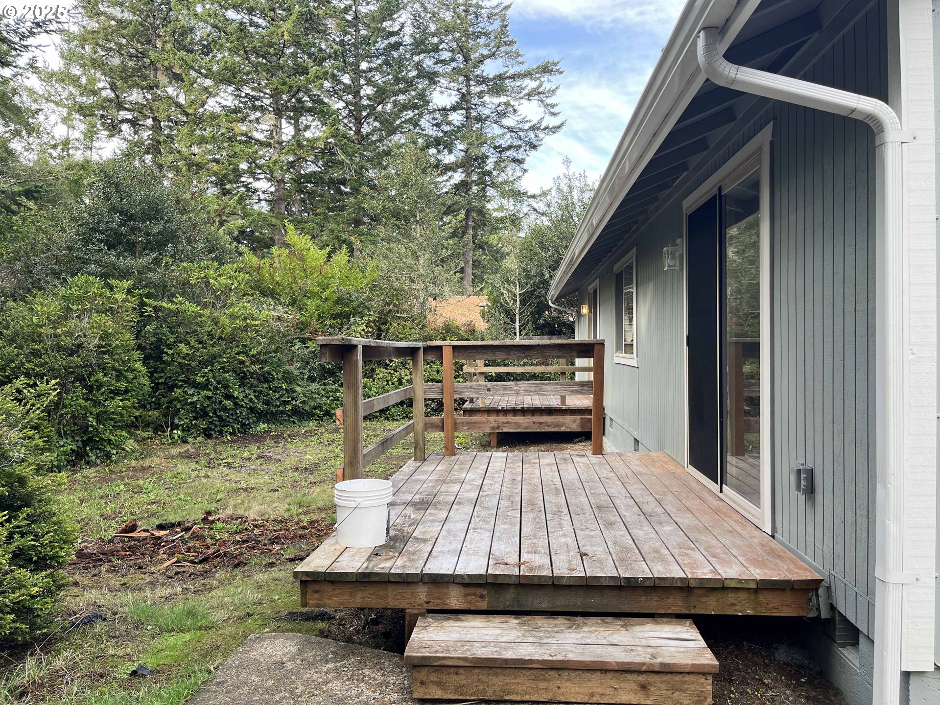 2040 11th Street Florence, OR 97439 - Photo 35 of 43 a view of barbeque area with wooden stairs