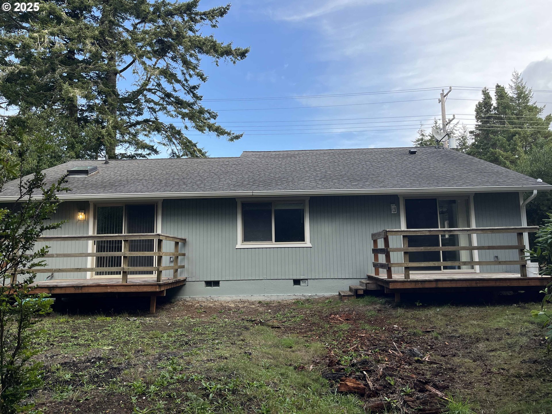 2040 11th Street Florence, OR 97439 - Photo 38 of 43 a house view with a garden space