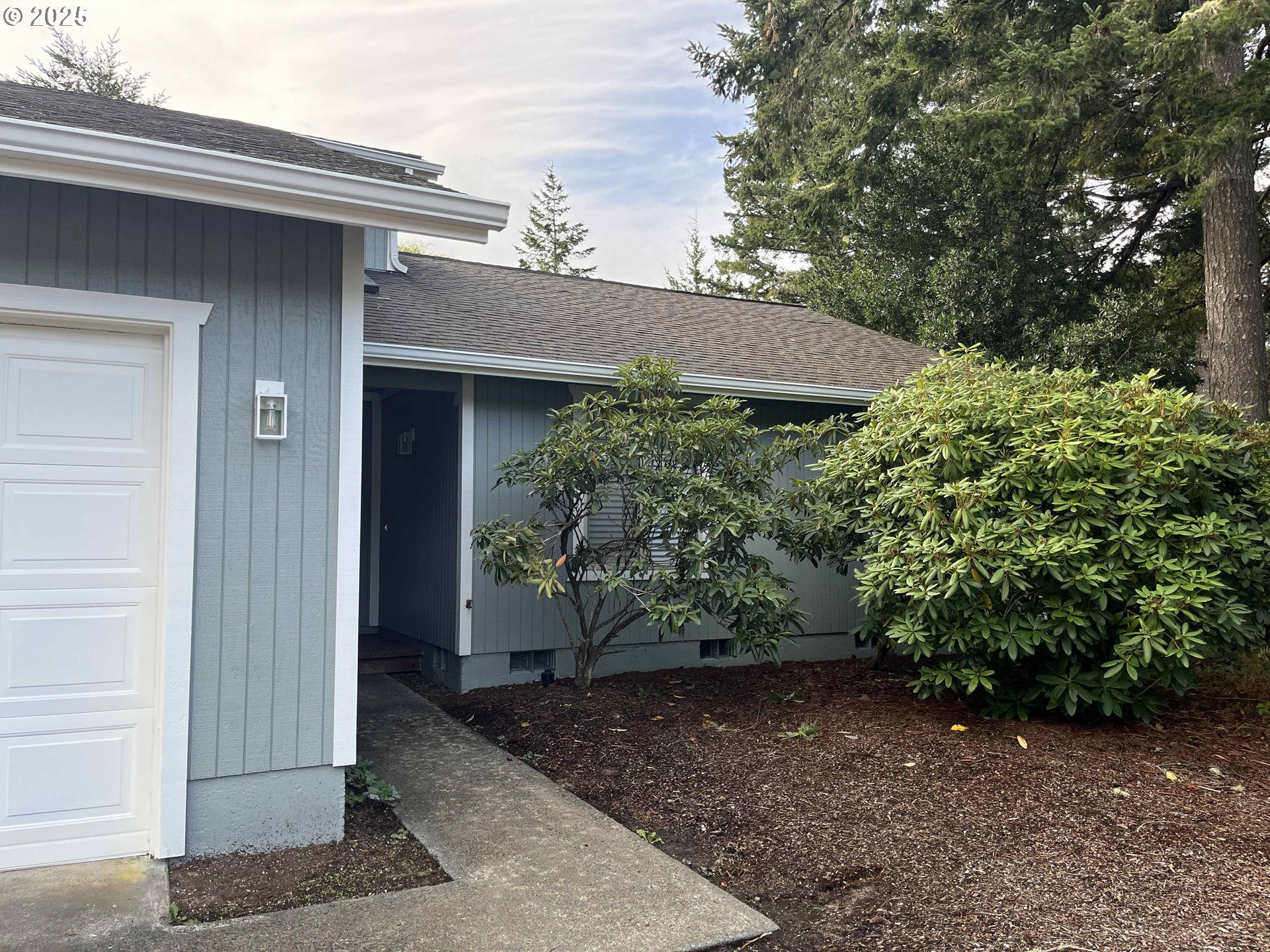 2040 11th Street Florence, OR 97439 - Photo 5 of 43 a view of a house with a yard