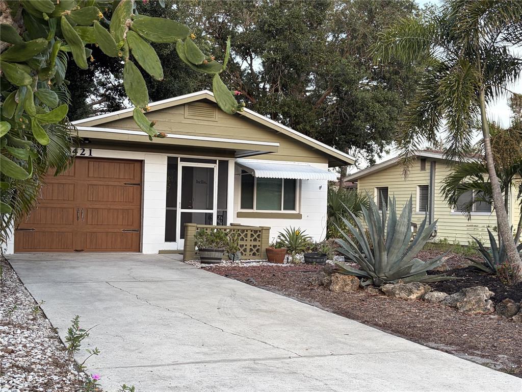 421 Riviera Street Venice, FL 34285 - Photo 2 of 30 a front view of a house with garden