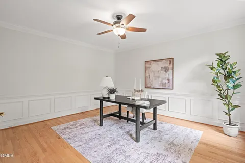 a work room with furniture and wooden floor