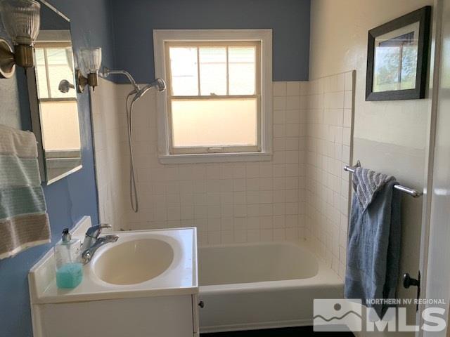 435 West Taylor Street Reno, NV 89509 - Photo 6 of 15 a bathroom with a tub sink and mirror