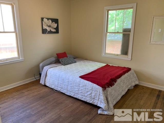 435 West Taylor Street Reno, NV 89509 - Photo 7 of 15 a bedroom with a bed and wooden floor