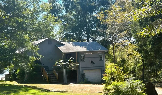 a front view of a house with yard