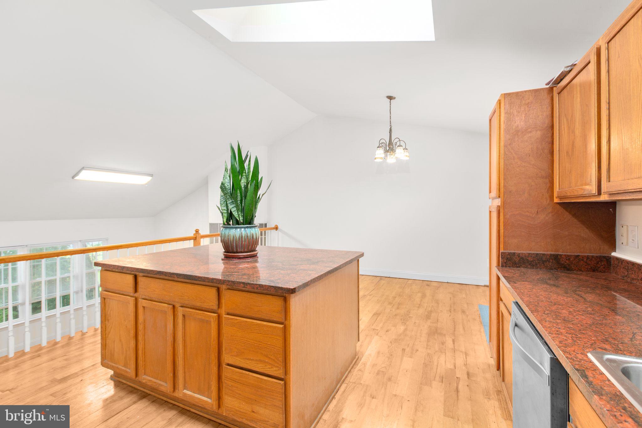 53 Bloomington Lane Stafford, VA 22554 - Photo 11 of 60 a kitchen with stainless steel appliances granite countertop a sink a faucet cabinets and a dining table