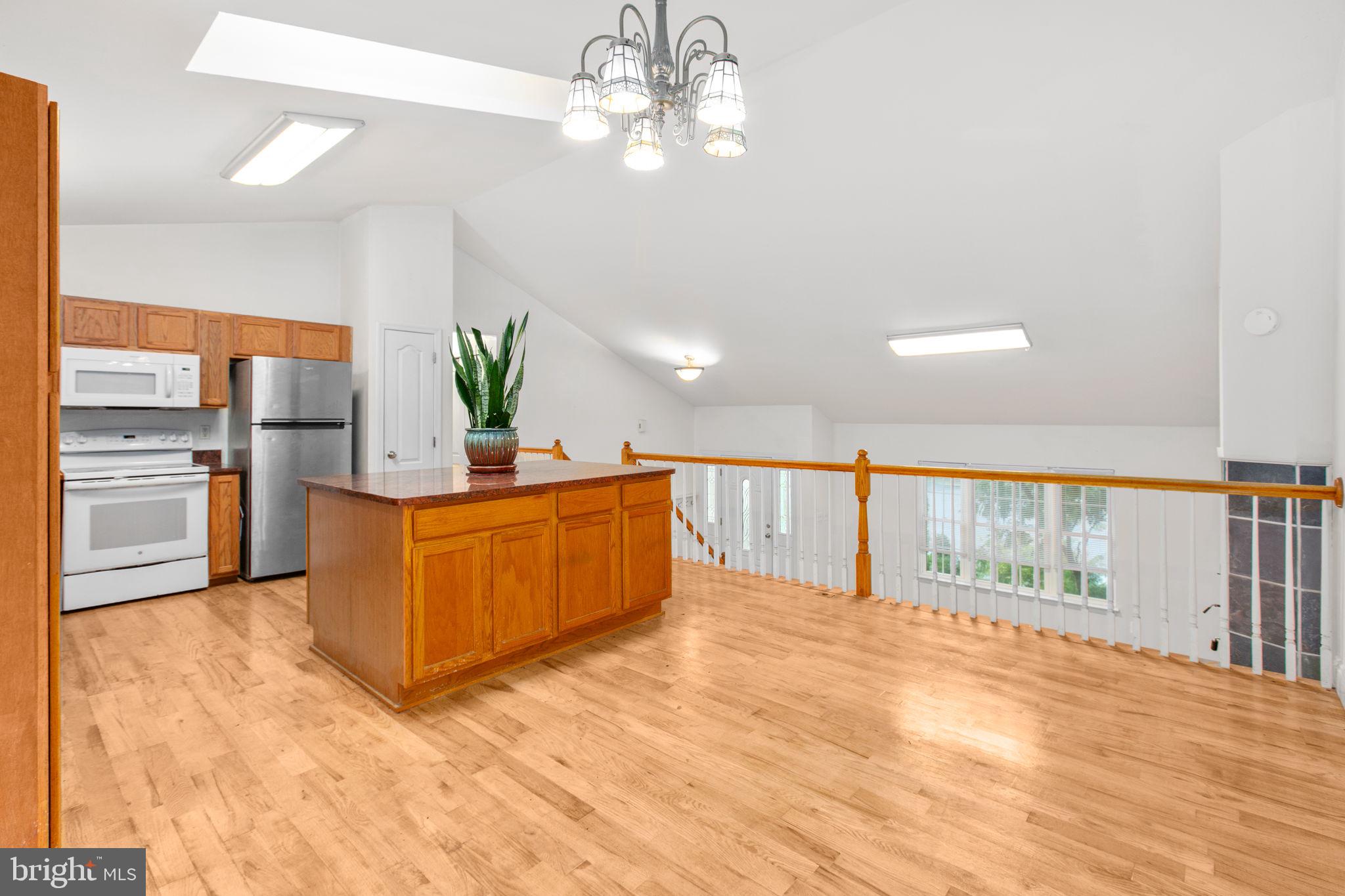 53 Bloomington Lane Stafford, VA 22554 - Photo 13 of 60 a view of a kitchen with kitchen island a counter top space a sink stainless steel appliances and cabinets