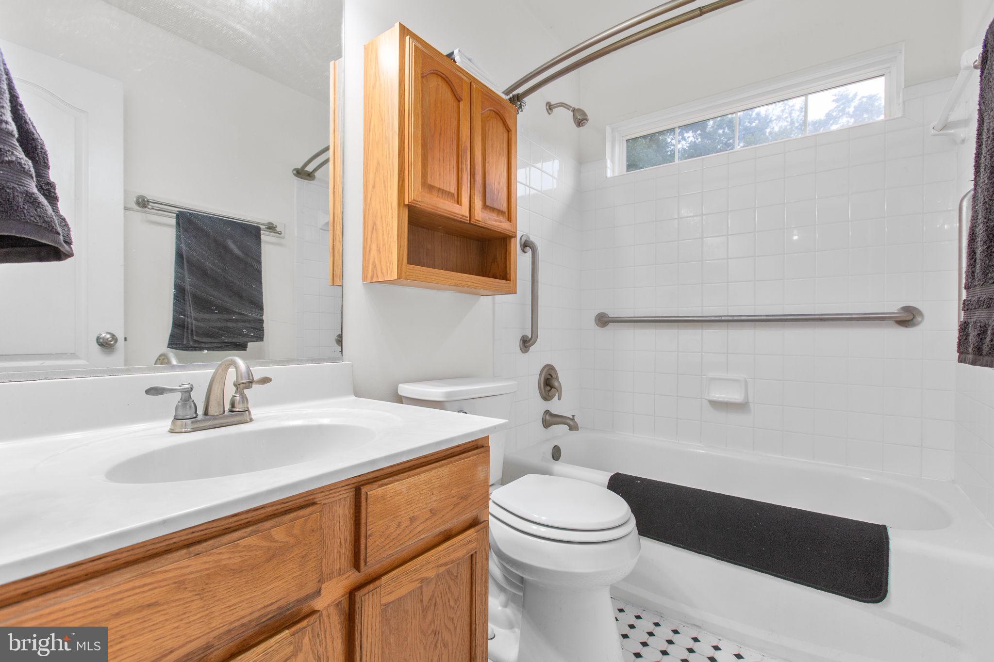 53 Bloomington Lane Stafford, VA 22554 - Photo 22 of 60 a bathroom with a sink a toilet a mirror and shower