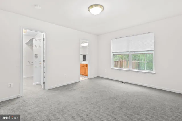 an empty room with a empty space and window