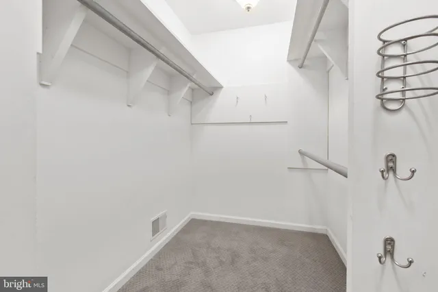 a view of an empty room with glass door