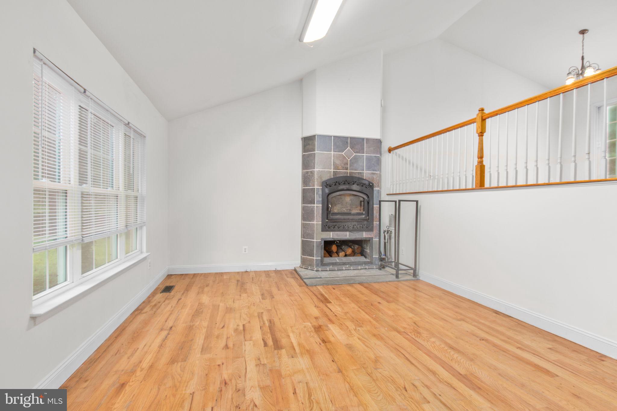 53 Bloomington Lane Stafford, VA 22554 - Photo 4 of 60 a view of empty room with wooden floor and fan