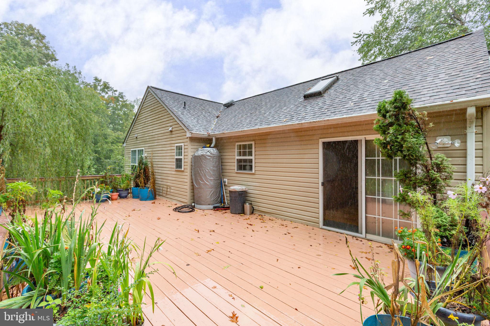 53 Bloomington Lane Stafford, VA 22554 - Photo 50 of 60 a front view of a house with a yard and potted plants