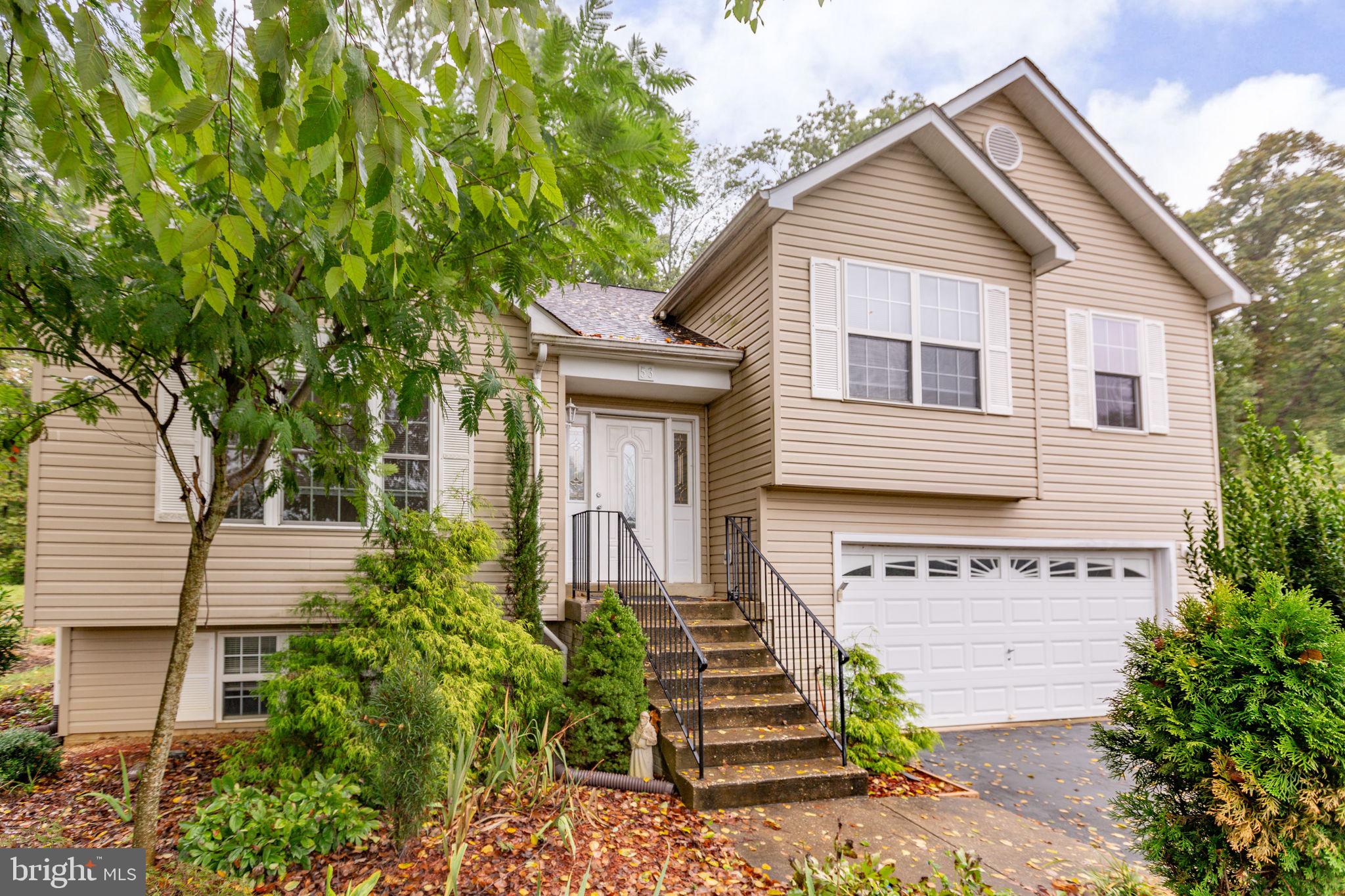 53 Bloomington Lane Stafford, VA 22554 - Photo 56 of 60 a front view of a house with a yard