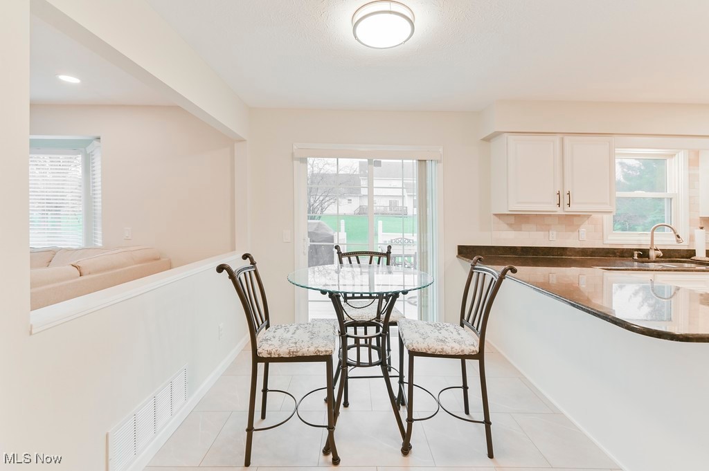 482 Longspur Road Highland Heights, OH 44143 - Photo 16 of 47 Dining room with visible vents, recessed lighting, light tile patterned floors, and plenty of natural light