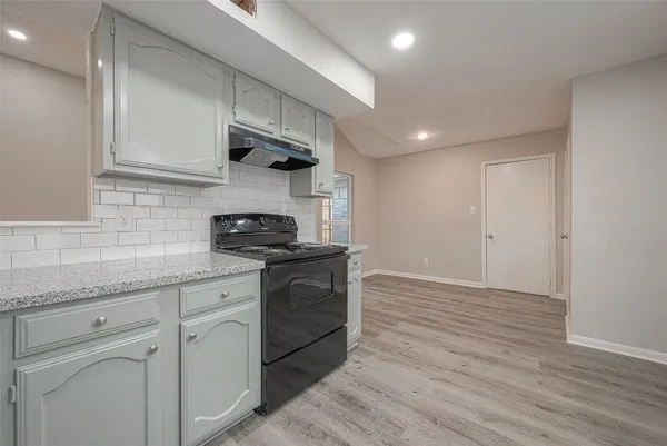 a bedroom with a bed and a potted plant