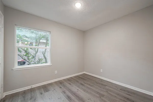 a bathroom with a shower and a toilet
