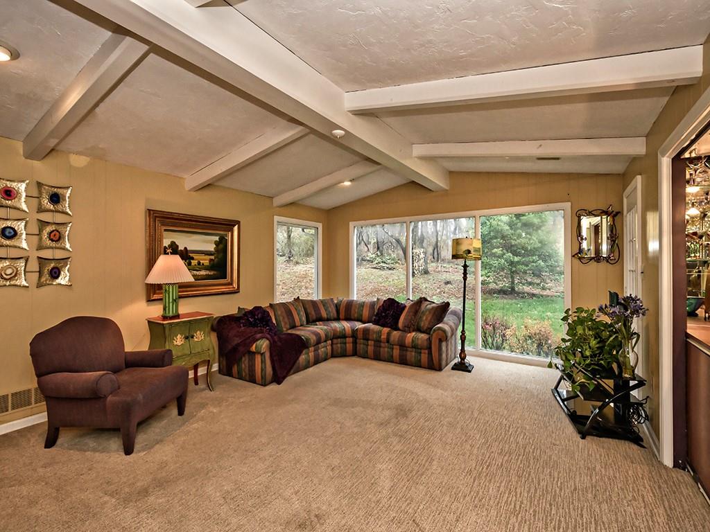 936 Field Club Road Pittsburgh, PA 15238 - Photo 7 of 25 Family room with bar area, wood burning fireplace and lovely views of the private wooded back yard.