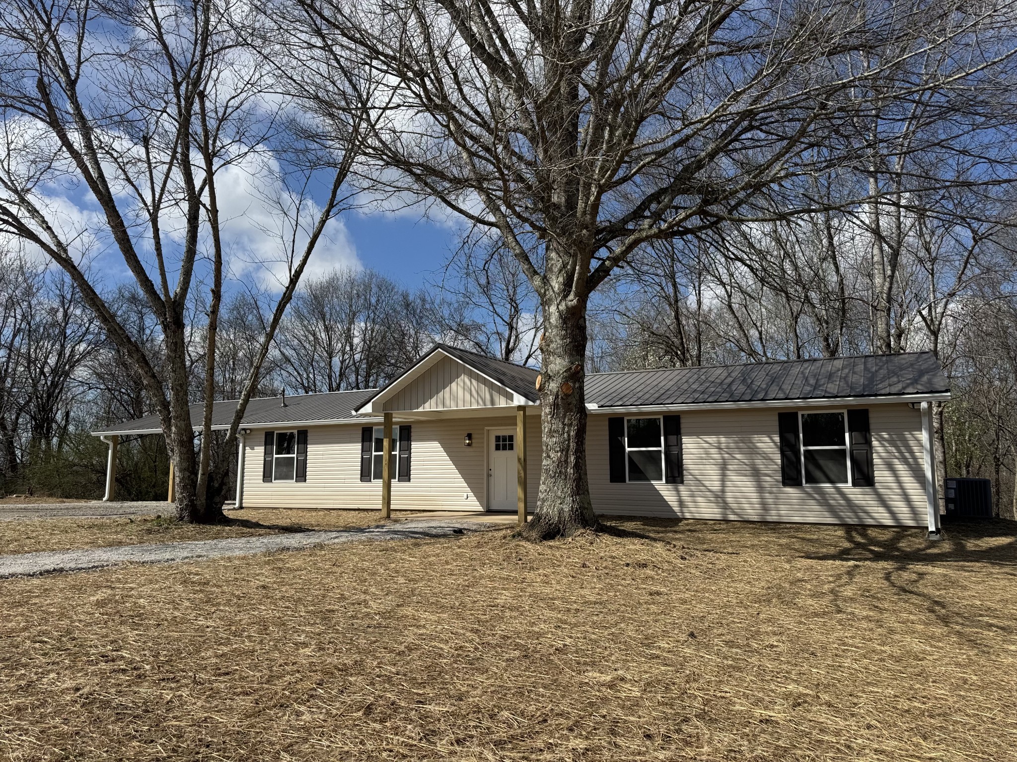 a front view of a house with a yard