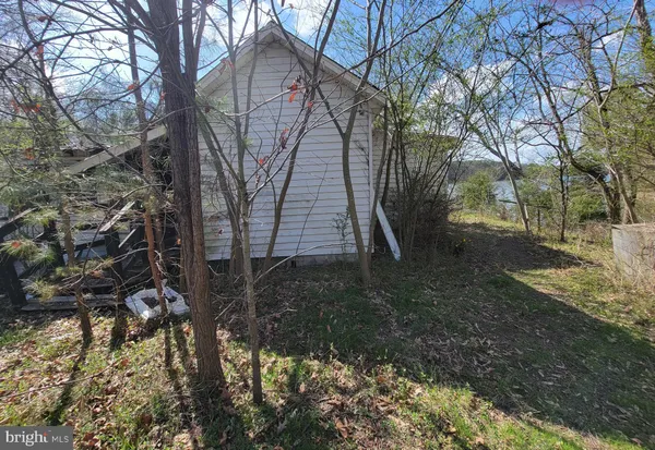 a backyard of a house with barbeque oven