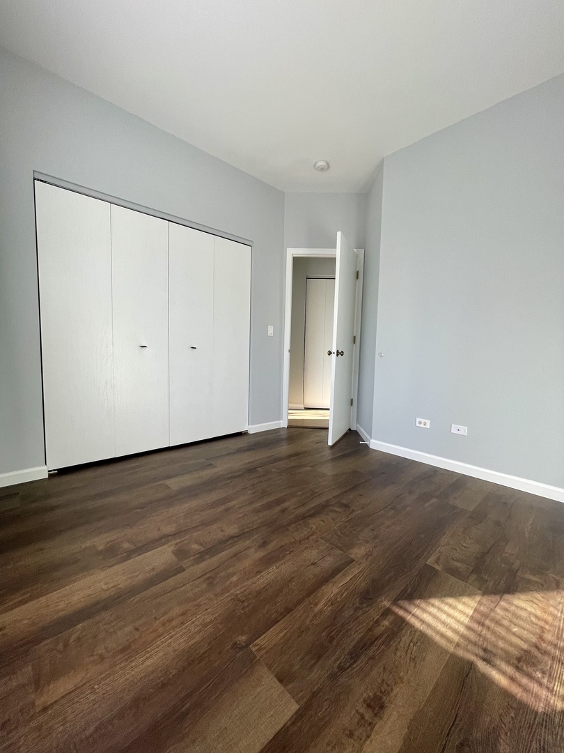 16623 Natoma Drive, Unit 16623 Lockport, IL 60441 - Photo 17 of 27 a view of an empty room and wooden floor