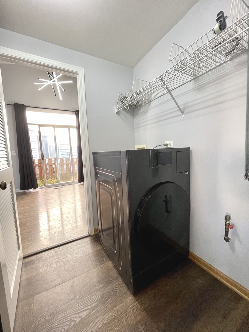 16623 Natoma Drive, Unit 16623 Lockport, IL 60441 - Photo 20 of 27 a utility room with wooden floor washer and dryer