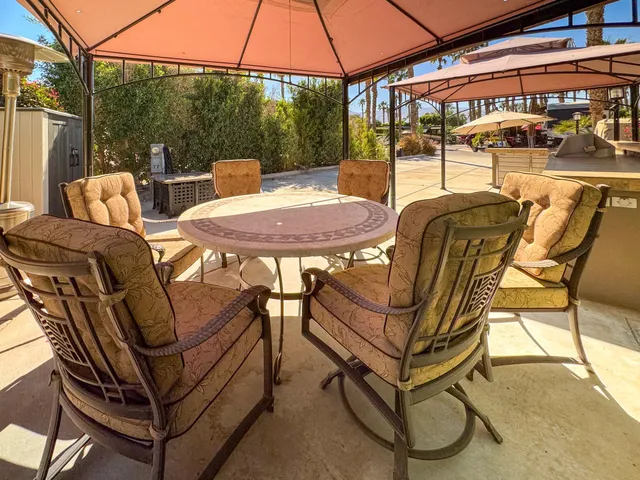 a view of a two chairs in the patio