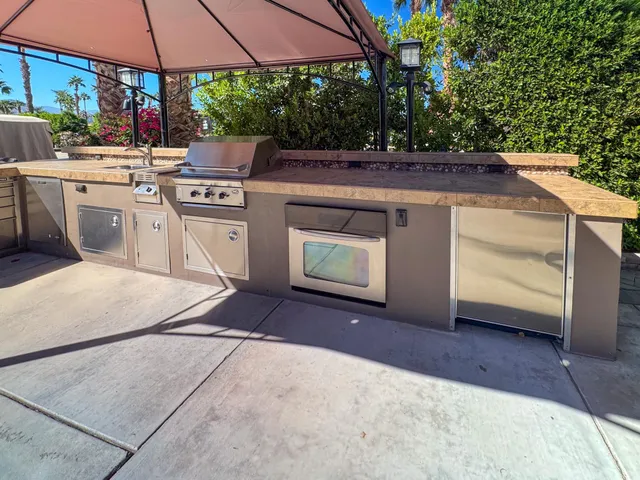 a view of a kitchen with a stove and a microwave