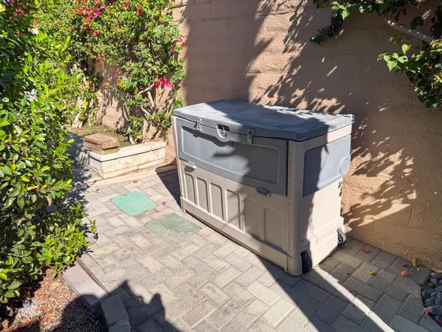 a view of a wooden house with a tree