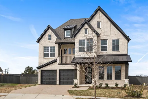 a front view of a house with large windows