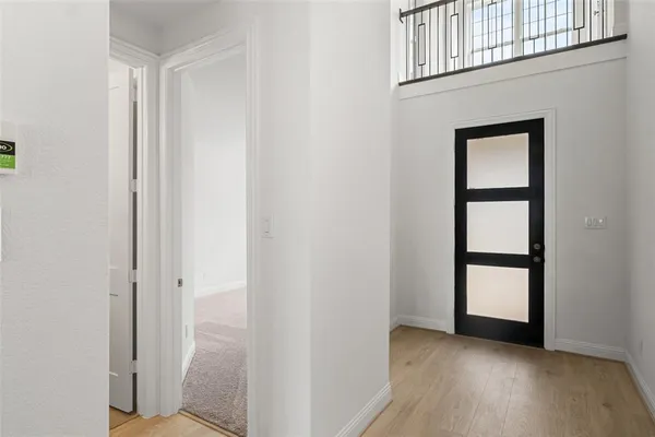 an empty room with windows and closet