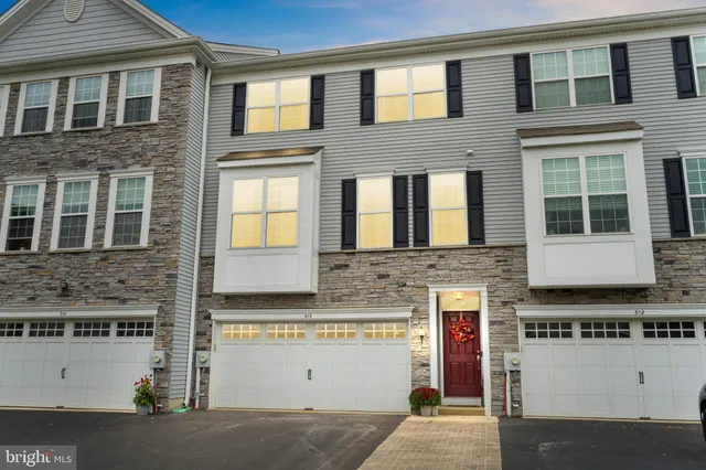 a front view of a house with stairs