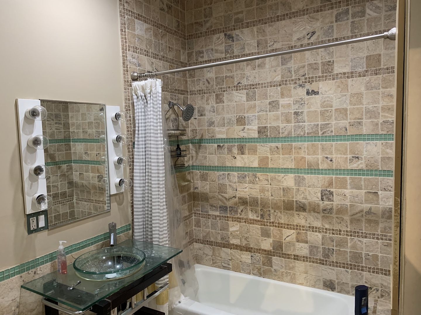 Undisclosed Address Chicago, IL 60657 - Photo 11 of 11 a bathroom with a shower and a sink