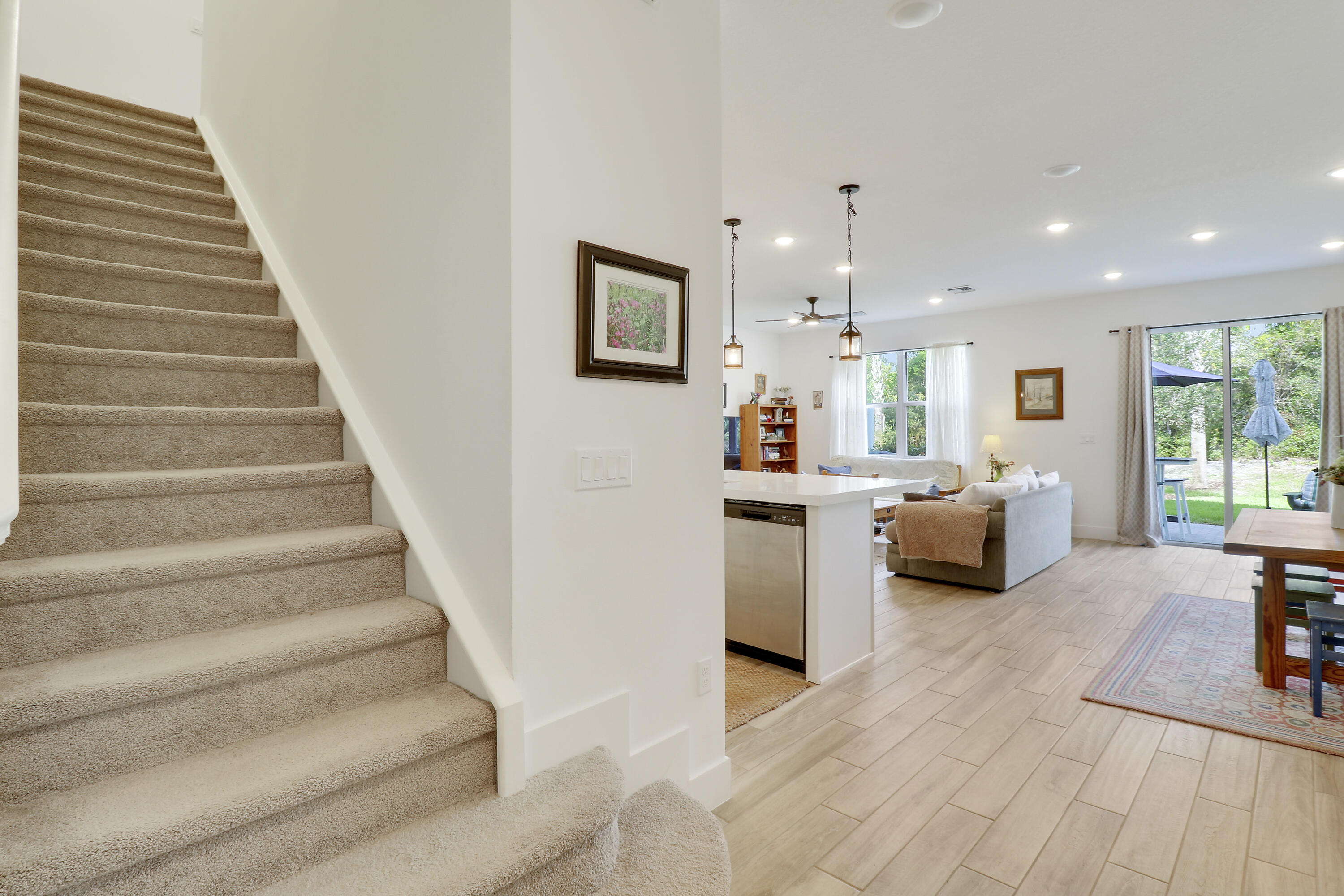 1416 Gopher Terrace Stuart, FL 34994 - Photo 3 of 53 a living room with furniture and a chandelier