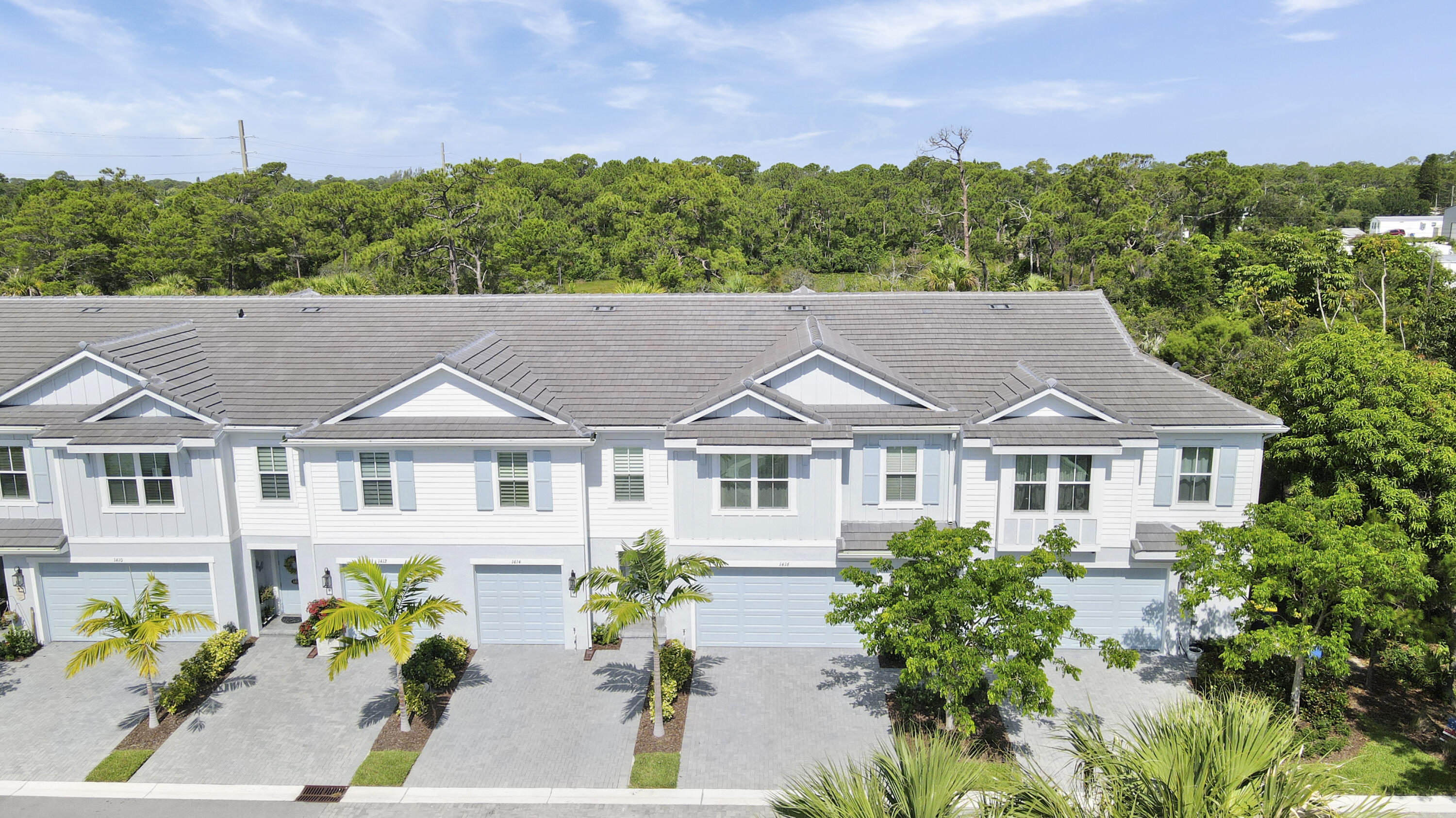 1416 Gopher Terrace Stuart, FL 34994 - Photo 33 of 53 a aerial view of a house with a garden and a yard