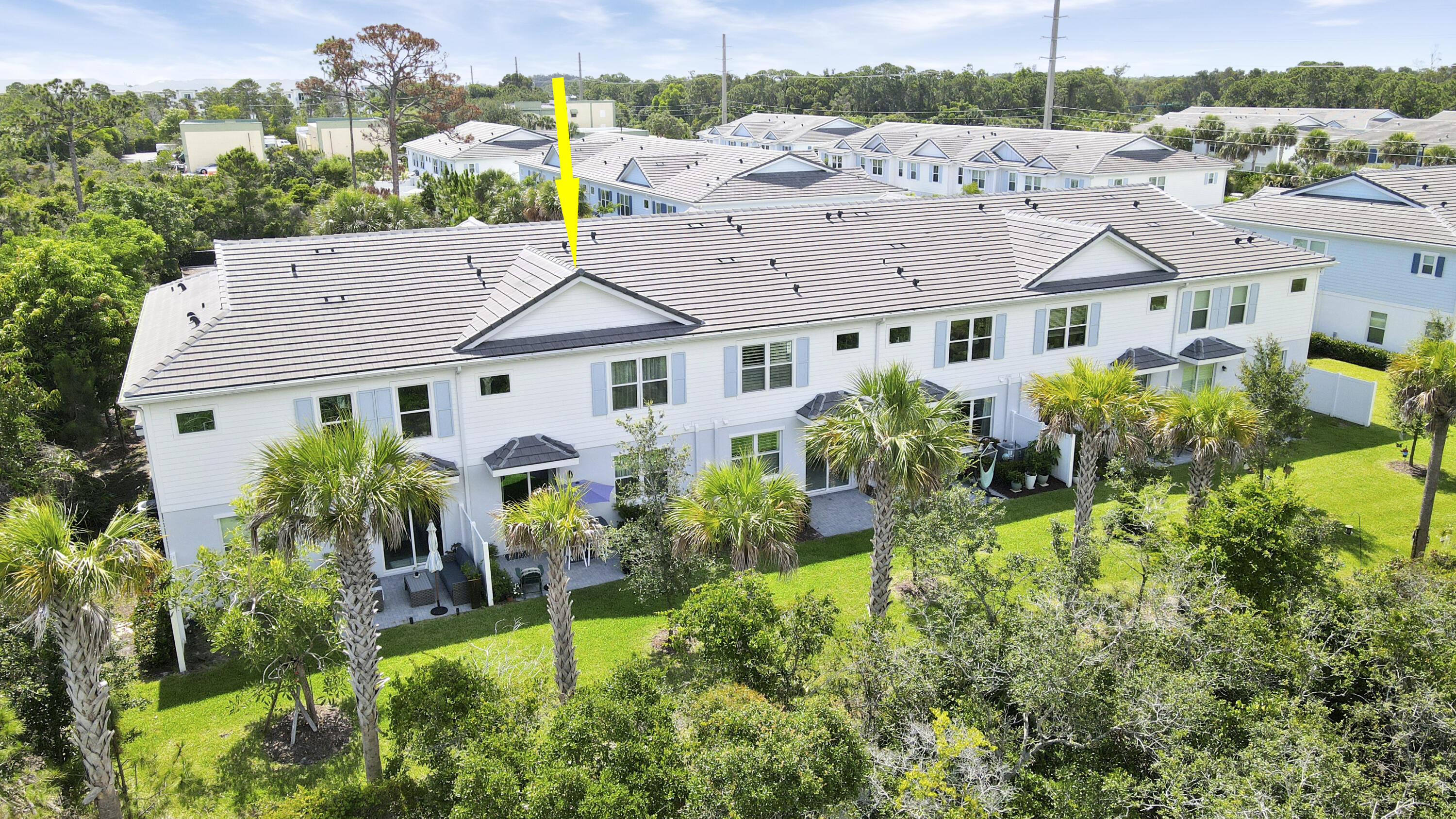 1416 Gopher Terrace Stuart, FL 34994 - Photo 40 of 53 a view of a white house with a big yard and potted plants