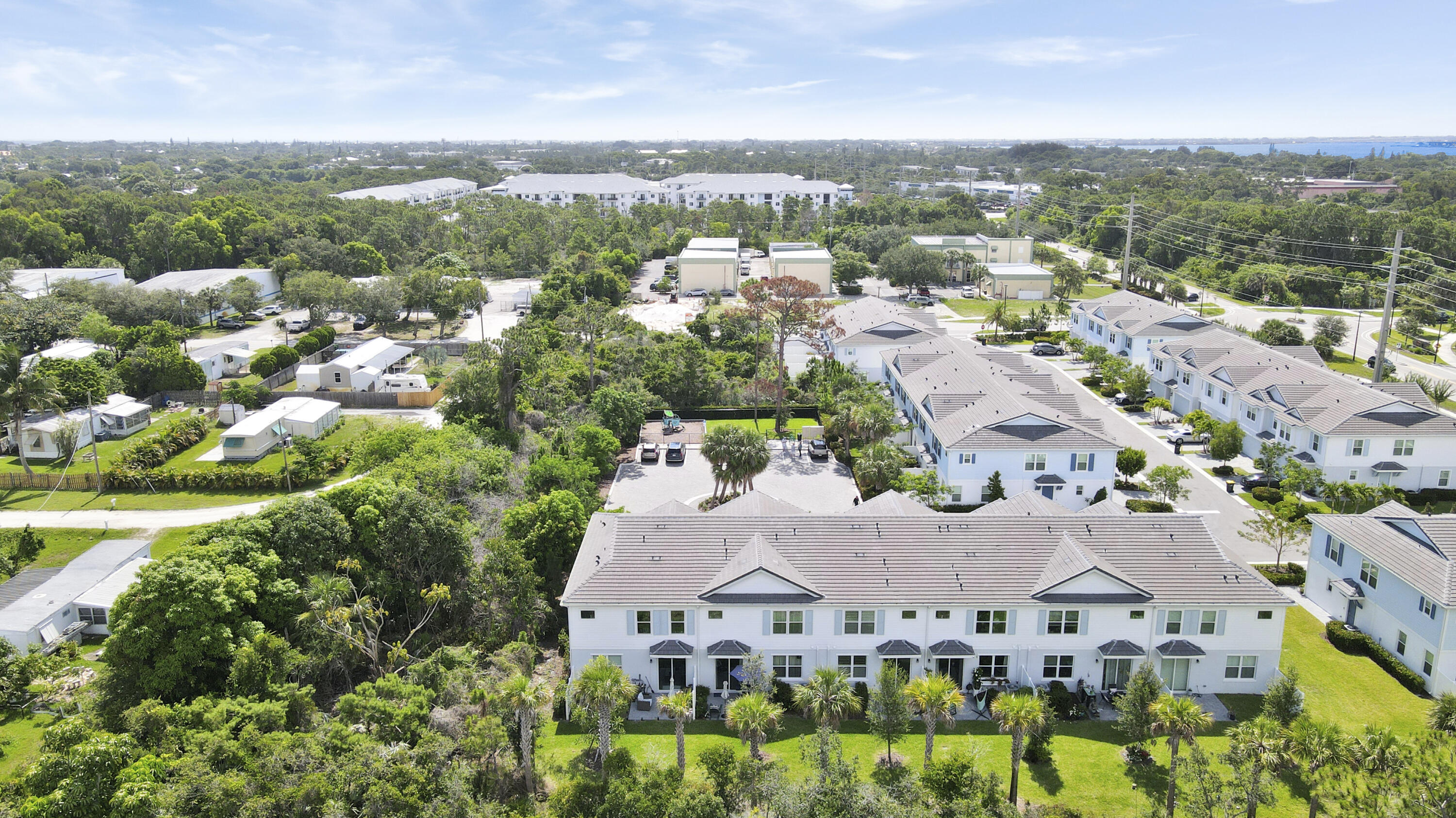 1416 Gopher Terrace Stuart, FL 34994 - Photo 49 of 53 an aerial view of residential houses with outdoor space and trees