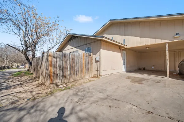 a kitchen with stainless steel appliances a sink stove and cabinets