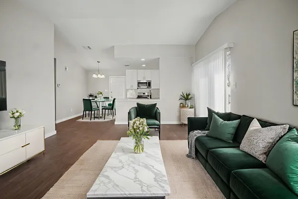 a living room with furniture and a table