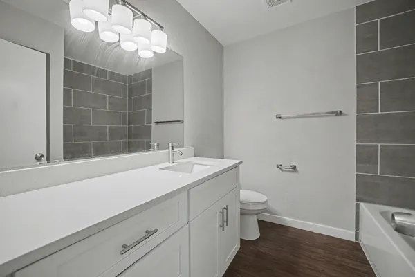 a bathroom with a bathtub and a shower
