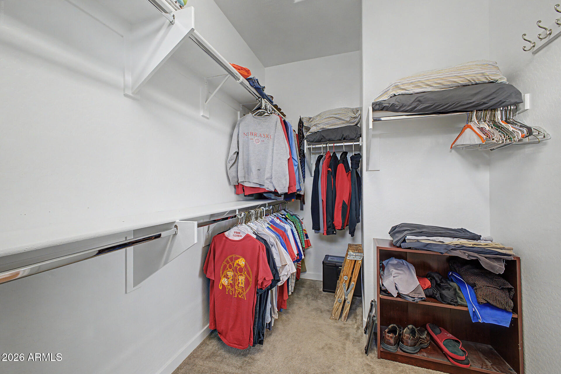 819 West Deer Creek Road Phoenix, AZ 85048 - Photo 39 of 76 a view of walk in closet with clothes and shoes