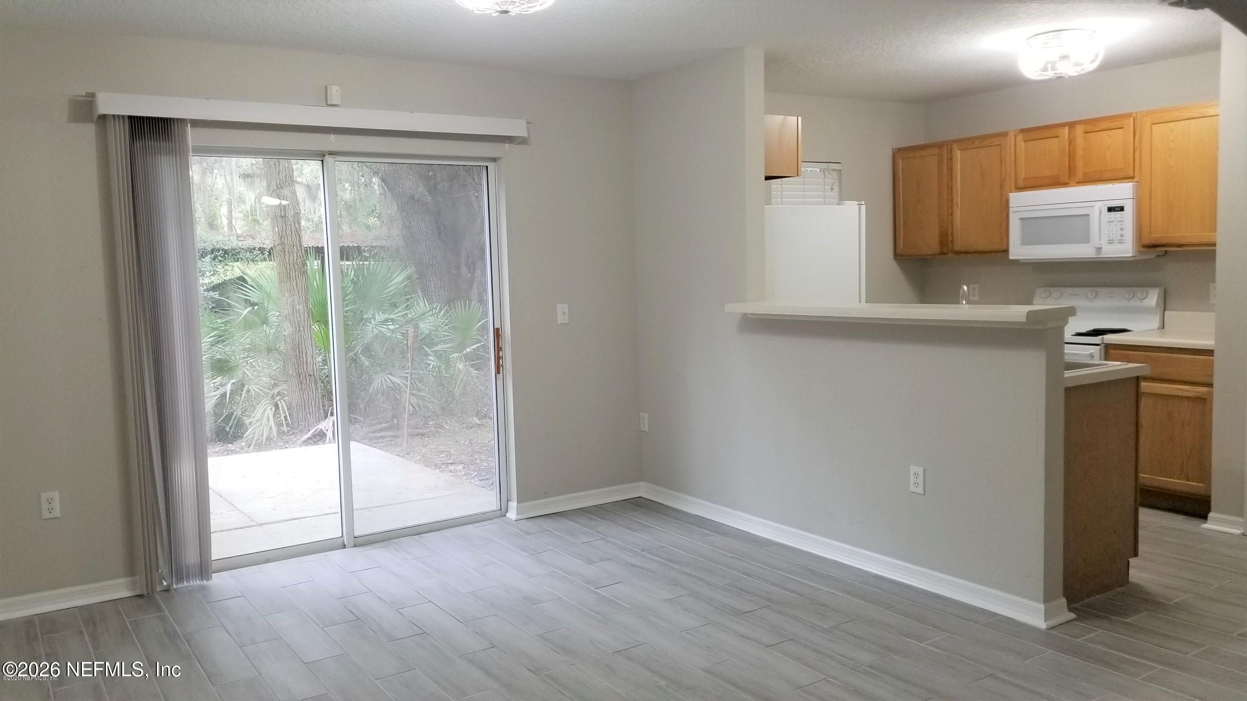 10462 Autumn Trace Road Jacksonville, FL 32257 - Photo 6 of 7 a view of a kitchen with a sink and a window
