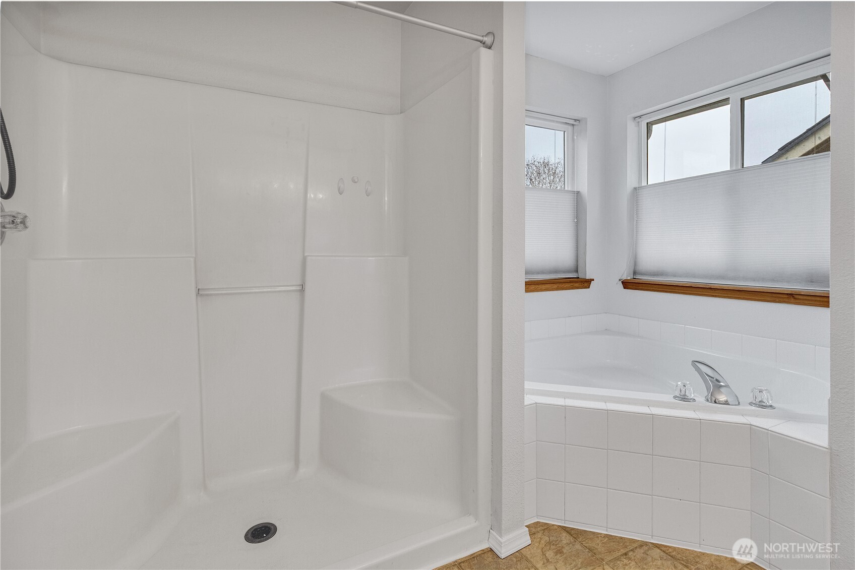 7027 Bailey Street Southeast Lacey, WA 98513 - Photo 16 of 27 a bathroom with a bathtub