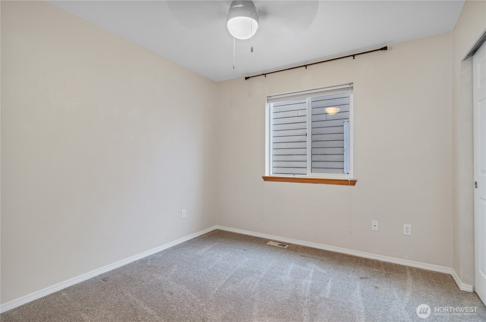 7027 Bailey Street Southeast Lacey, WA 98513 - Photo 19 of 27 an empty room with a window