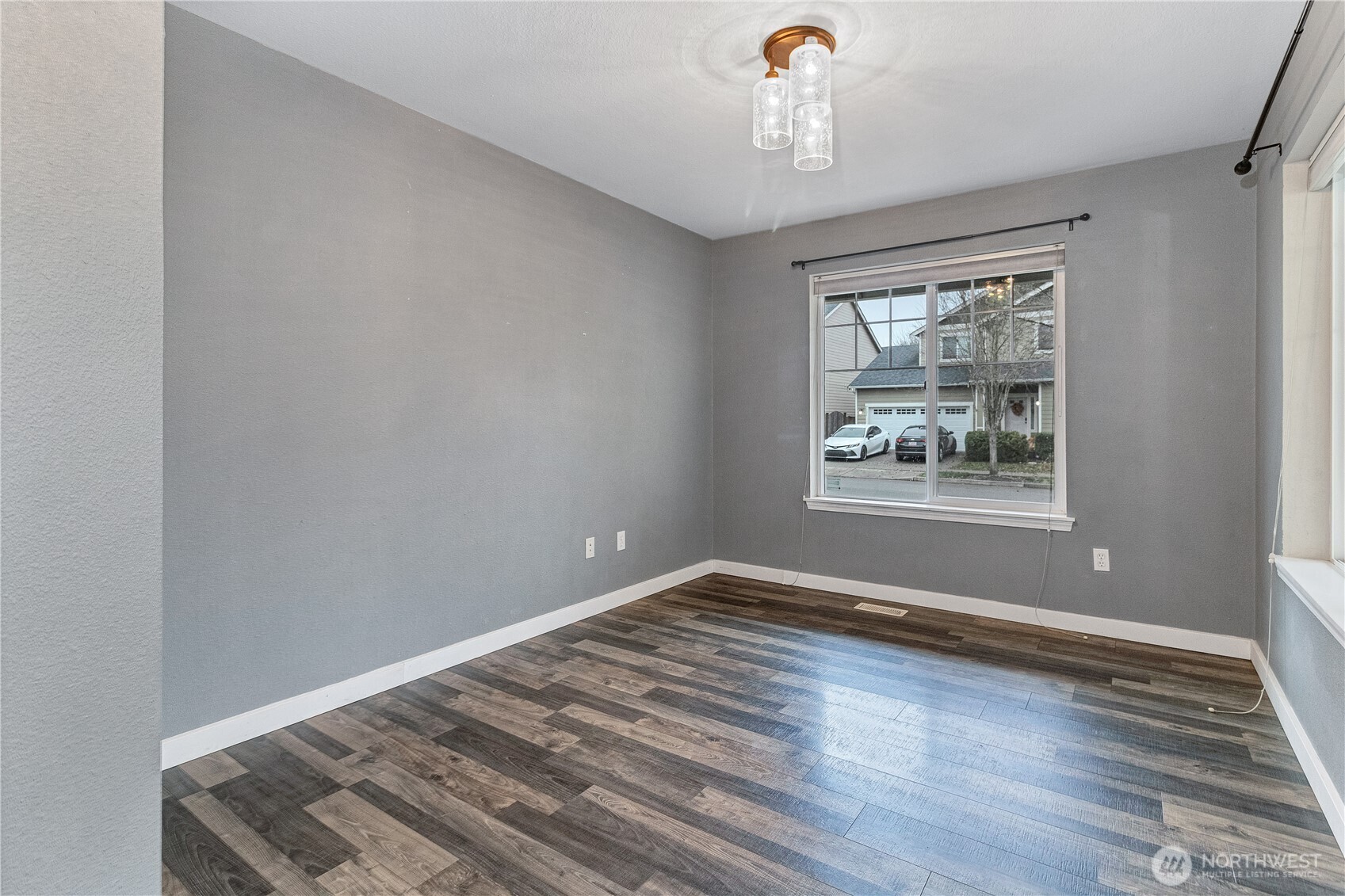 7027 Bailey Street Southeast Lacey, WA 98513 - Photo 23 of 27 a view of wooden floor and windows in a room