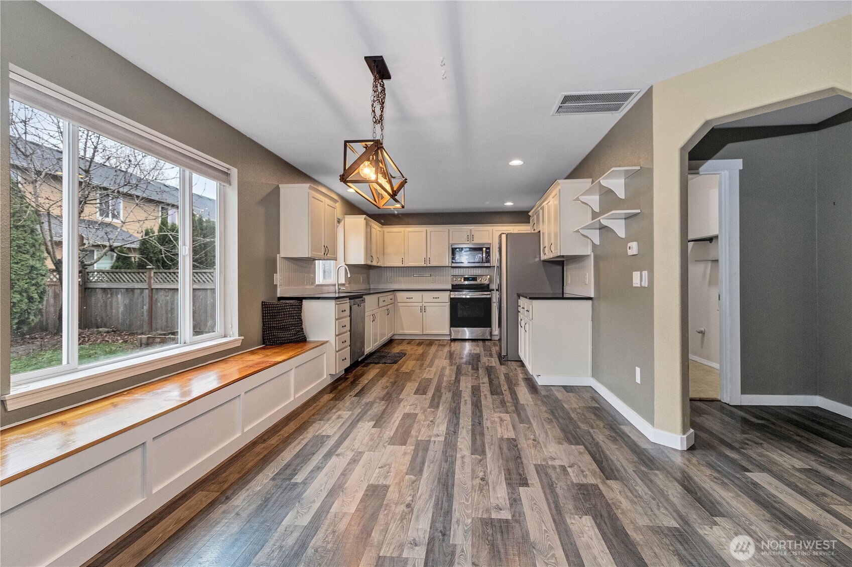 7027 Bailey Street Southeast Lacey, WA 98513 - Photo 9 of 27 a view of a kitchen with a large window