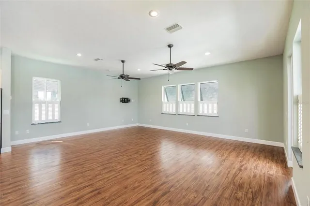 a kitchen with a stove and white cabinets