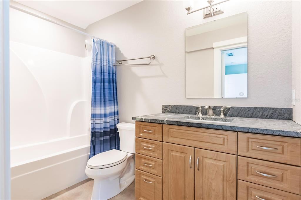 9691 Southwest Anchor Arcadia, FL 34269 - Photo 55 of 74 a bathroom with a granite countertop toilet sink and mirror