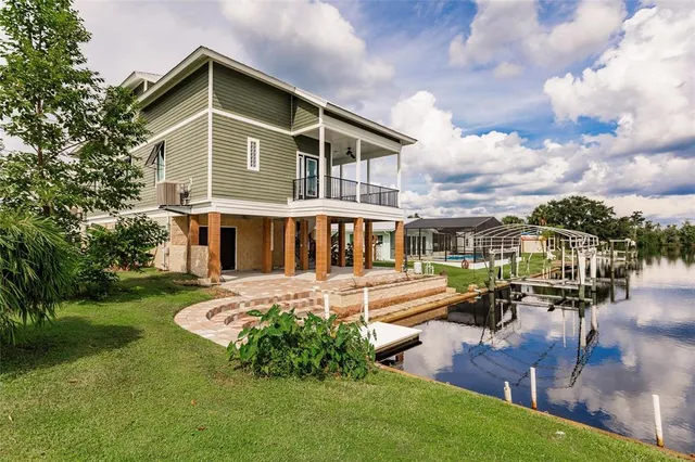 a view of a balcony with wooden floor and outdoor space
