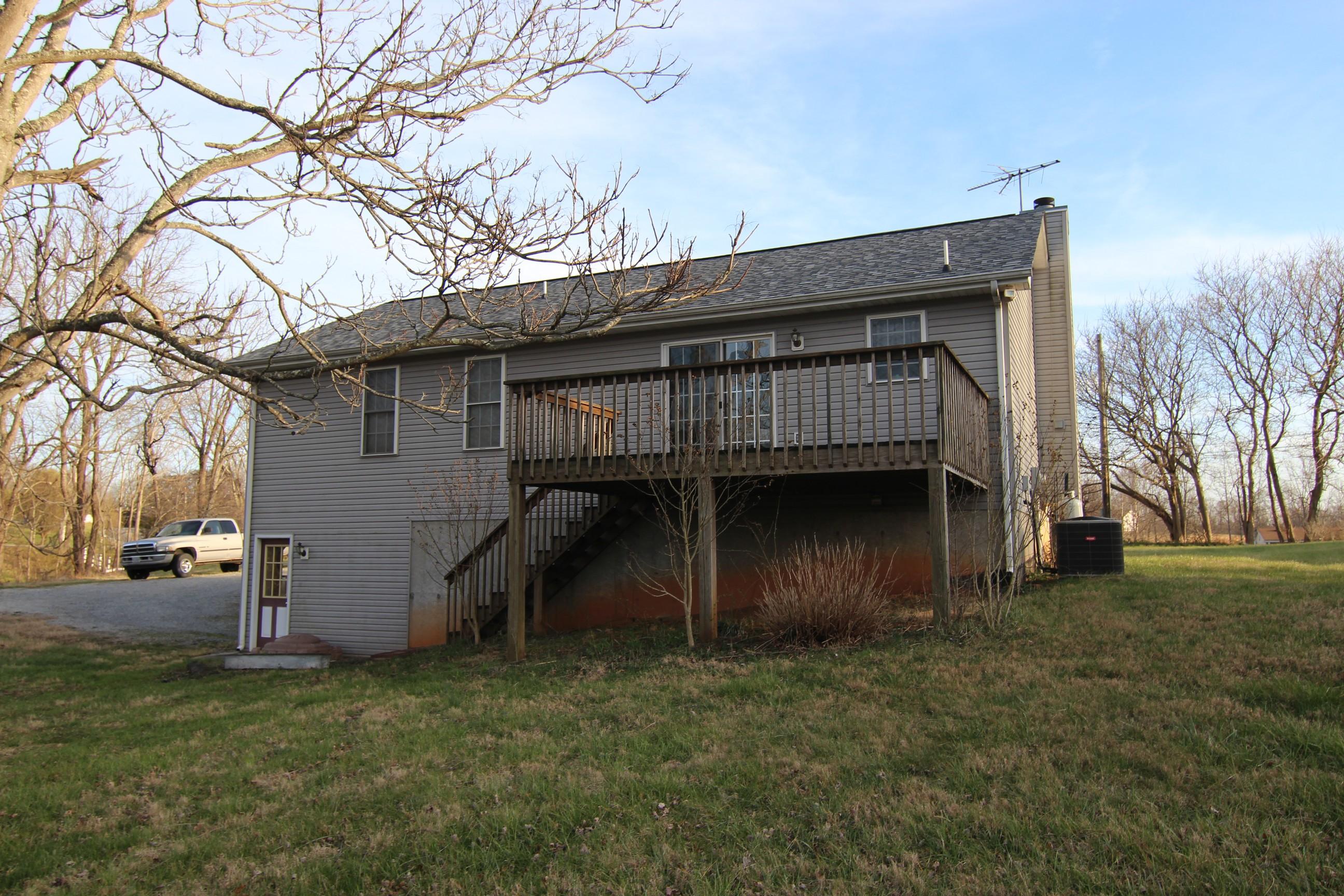6878 Goodview Road Goodview, VA 24095 - Photo 11 of 15 a view of a house with a yard
